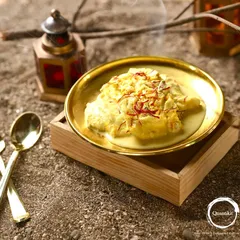 The Classic Saffron Shahi Tukda, presented elegantly on a wooden block. This dessert is a symphony of crispy, creamy, and saffron-dreamy textures and flavors.