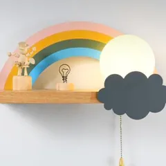 This rainbow shelf comes with a built-in cloud light, adding a warm and magical glow to the room. It’s a multi-functional piece that serves as a shelf, a night light, and a beautiful piece of wall art.