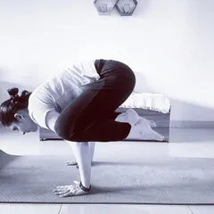 A still of Kakasana (Crow Pose). This asana is fantastic for building arm and core strength, but more importantly, it improves concentration and mental focus.