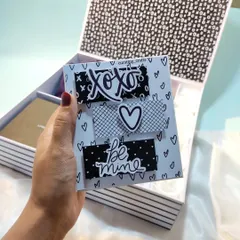Inside the gift box, a "Be Mine" mini album is ready to be discovered.