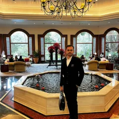 Pictured here in a professional setting suitable for client consultations. I ensure my clients feel comfortable and confident when discussing sensitive legal matters.