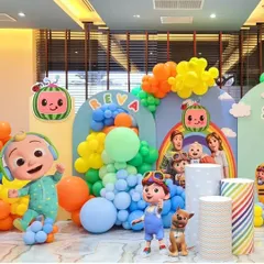 A vibrant and immersive Cocomelon themed birthday party setup. This decoration features multiple character cutouts, rainbow-colored balloon garlands, and personalized backdrops to create a fun and recognizable world for the little ones.