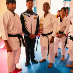 Posing with our newly promoted black belts. Their dedication and perseverance have paid off.