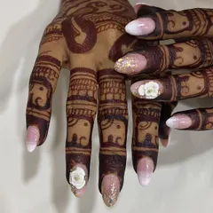 A close-up view of the 3D floral work and glitter accent nail. I pay close attention to every detail to ensure your wedding nails are flawless from every angle.