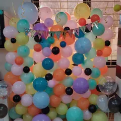 This vibrant balloon wall is a cheerful way to say 'Welcome'. I used a mix of colorful latex balloons in various sizes and a cute 'Welcome' bunting to create a perfect party backdrop.
