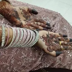 This is another example of the beautiful stain you can achieve with my organic henna, seen here with the bride's bangles. The deep color on the fingertips is a classic part of the bridal look.