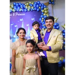 This family looks picture-perfect in their custom golden and royal blue outfits for a birthday celebration.
