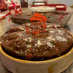 For a little twist on the classic Christmas cake, I added a layer of my homemade caramel sauce on top of this rum cake. It adds a wonderful sweetness and gooey texture.