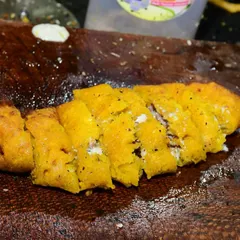 A close-up of one of our special tava preparations, chopped and mixed with rich masalas.