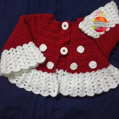 A cozy red and white polka dot crochet jacket for a baby girl. This piece is perfect for layering and adds a touch of handmade charm to any outfit, keeping your little one warm and stylish.