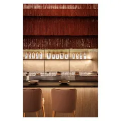 This cascading tassel light at Lucky Chan is a statement piece that adds drama and a soft, whimsical texture. It demonstrates our use of lighting not just for illumination, but as a sculptural art form.