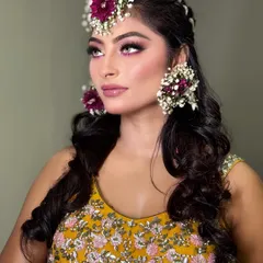 A side profile showing the pop of colour on the eyes. This look is fresh, youthful, and perfect for a daytime Haldi ceremony.