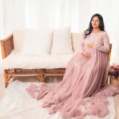 Simple, elegant, and minimal is my style. This portrait showcases a gorgeous flowing gown and a serene studio setting to capture the beauty of pregnancy.
