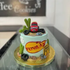 Here's a fun cake based on the popular show Blaze and the Monster Machines. We used fondant to create the character and desert-themed elements like cacti and tires.
