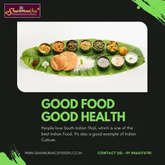 A classic South Indian thali served on a fresh banana leaf. This meal includes rice, poori, and a variety of vegetable curries and pachadis, representing a wholesome and culturally rich dining experience.