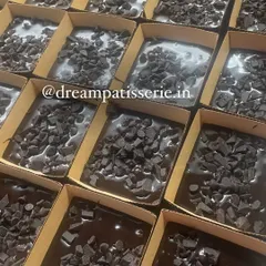 A batch of our chocolate brownies, topped with chocolate chips, ready to be baked for a bulk corporate order.