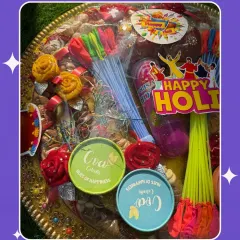 Our festive hamper tray is perfect for a grand Holi gesture. It's loaded with dry fruits, gulal, water balloons, and other festive delights, all beautifully wrapped and ready to gift.