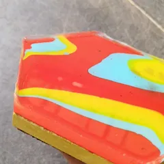 A side view of a coaster, showing the thickness of the concrete base and the smooth, glassy finish of the resin. I pay a lot of attention to these details.