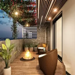 We designed this balcony for cozy evenings, complete with comfortable wicker chairs, a fire pit, and overhead string lights. The space is surrounded by plants, creating a magical urban getaway.