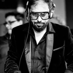 In the zone. A candid shot from a gig, focused on the music and the mix. This is my happy place.