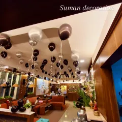 This photo shows how ceiling balloons can completely change the feel of a venue, adding a festive and celebratory touch to the entire space.