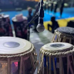 A close-up of my tabla setup on stage at a large event in Goa. This perspective shows the professional miking techniques used to capture the best possible sound during a live performance.