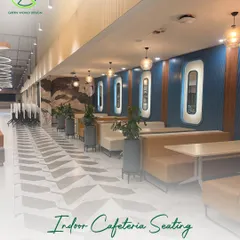 For the indoor cafeteria at Accenture, I wove greenery into the seating arrangements. This integration of plants softens the architecture and creates a more relaxed, restorative dining experience within a corporate setting.