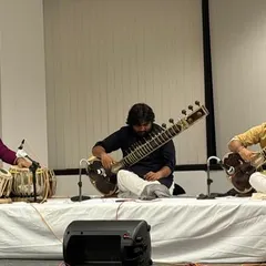 On stage in Chicago for a sitar duet concert. This setup, with two sitars and a tabla, allows for a rich interplay of melodies and rhythms, a core element of a classical jugalbandi.
