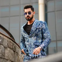 For the man who isn't afraid of bold patterns, this custom-printed denim suit features a unique blue and white splatter design. It’s a statement of individuality and high-fashion edge.