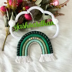 A close-up of a green-themed name hanging for Yashwardhan. You can see the detail in the rainbow wrap and the little name beads I add for that personal touch.