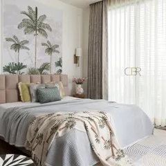 A bedroom should be a personal retreat, and for this master suite, I brought nature indoors with a custom tropical wall mural. The design balances this serene backdrop with a plush, tufted headboard and soft, layered textiles, creating a tranquil escape that feels both luxurious and grounded.