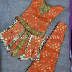 A bright orange brocade outfit with gold buti work, specially designed and stitched for a Hanuman ji idol.