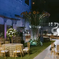 For this Bollywood-themed Sangeet, I created an outdoor lounge with dramatic floral centerpieces and an elephant motif bar, blending cinematic flair with sophisticated design.