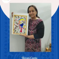 Student Shivani Gupta proudly holding her completed Madhubani painting. It's wonderful to see participants connect with this traditional art form from their own homes.