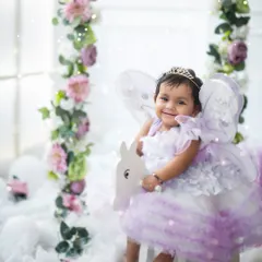 A true fairy princess on her magical rocking horse. Our fairy-themed shoots include beautiful dresses, wings, and dreamy setups to create an enchanting experience.