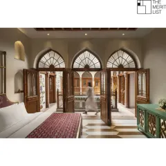 In this suite at the Golden Haveli, every detail is designed to connect the present with the past. The arched doorways open to the central courtyard, creating a seamless flow of space and light, a hallmark of traditional haveli architecture.