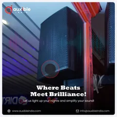 This is where beats meet brilliance. A close-up of a wall-mounted professional speaker, strategically placed to deliver optimal sound coverage, complemented by atmospheric LED lighting in the background.