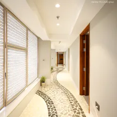 Your journey to tranquility begins the moment you walk down this hallway. The winding mosaic path is designed to lead you away from the city's noise and into the calm of my Iyasya Spa.