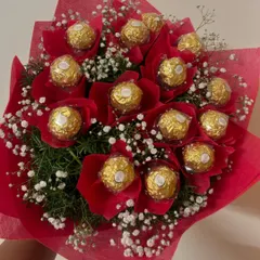 A passionate bouquet where each Ferrero Rocher is nestled in a vibrant red wrap, surrounded by delicate baby's breath. This is a perfect expression of love and affection.
