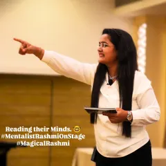 In this moment, I am connecting with an audience member during a corporate mentalism show. It's all about focus, engagement, and a little bit of mind-reading to create an unforgettable experience for professionals.