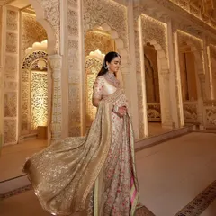 The full, flowing silhouette of Isha's floral Manish Malhotra saree. My goal with event styling is to ensure the client not only looks incredible but also feels comfortable and radiant.