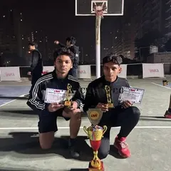 Two of our senior players from the U-17 category showcasing their trophies and certificates after the basketball winter league tournament. We train athletes to peak at competitive levels.