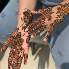 Another view of the modern Teej design, showing how the patterns flow from the palm to the wrist. The mix of bold shapes and fine lines is very eye-catching.