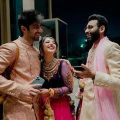 A candid moment of laughter with friends at a wedding. These are the moments we live for.
