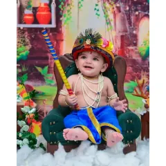 Here is a joyful Little Krishna, holding his flute with a happy grin. My cultural and festive photoshoots are designed with beautiful details, from the peacock feather crown to the traditional attire, to celebrate your heritage.