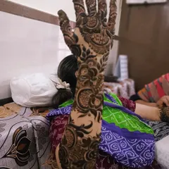 This is a beautiful example of a modern floral sleeve. The design flows from the hand up the arm, with large, detailed flowers and leaves creating a bold and elegant statement.