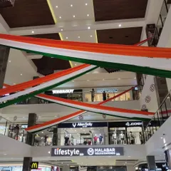 For this Independence Day project, we transformed a multi-level shopping mall with large, flowing tricolor fabric drapes. This shows our capability to handle large-scale commercial decoration projects, creating a patriotic ambiance that engages all visitors.