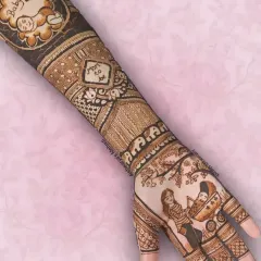 This full-arm baby shower design features a portrait of the expecting parents on the palm and a cute baby illustration on the arm, celebrating their growing family.