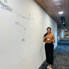 At the very beginning of a big project, standing in front of a huge, empty wall with big dreams for it. This was the start of the RHI Magnesita mural.