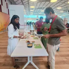 Here I am guiding an employee through our DIY food station. I focus on one-on-one interactions to answer questions and make nutrition feel personal and approachable, helping to build confidence in making healthier choices.